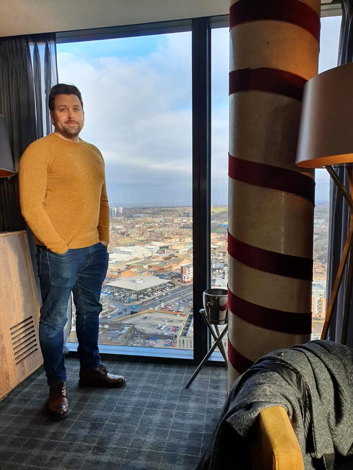 me-in-panoramic web design childwall - a picture of John Wilson web designer looking over the city of Livepool at the Panoramic Restaurant
