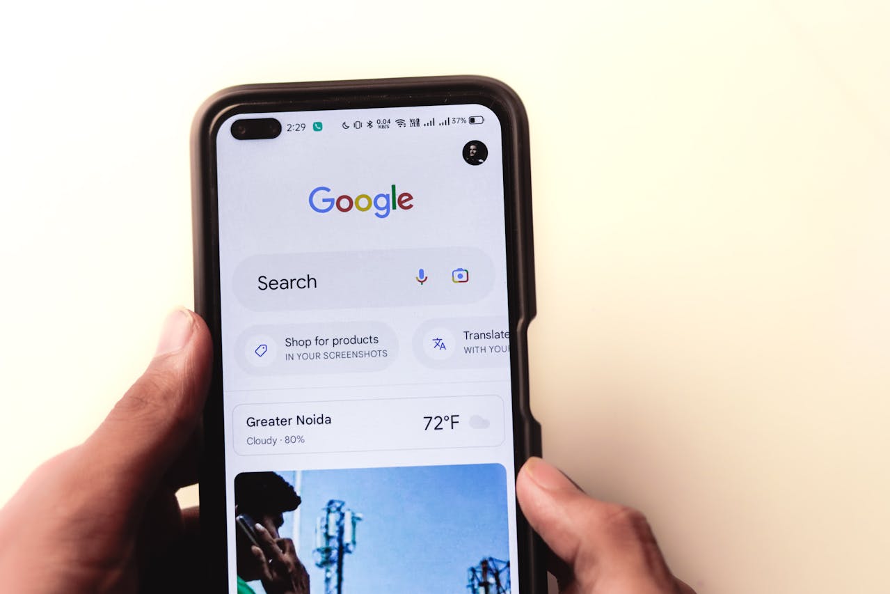 a picture of google on a mobile phone to represent mobile first web design and accessible web typography