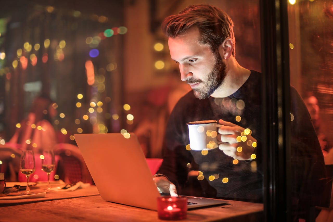 a man at a laptop looking at how much does it cost to get a website designed in Liverpool